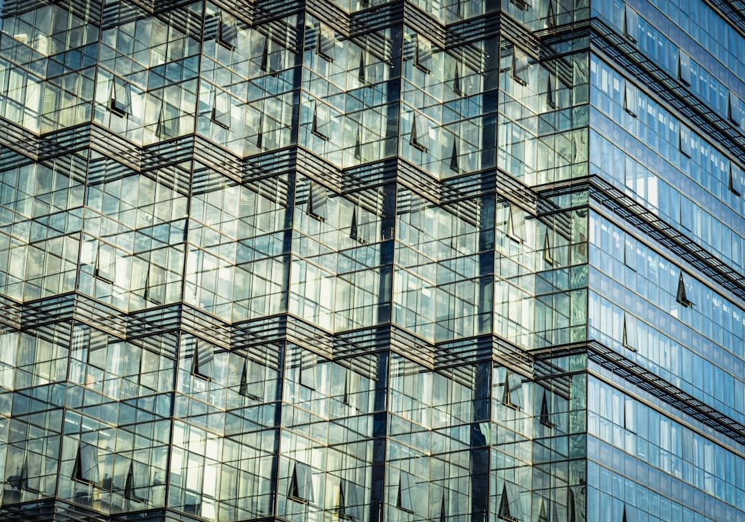 Structured glass facade pattern representing guidance and organization