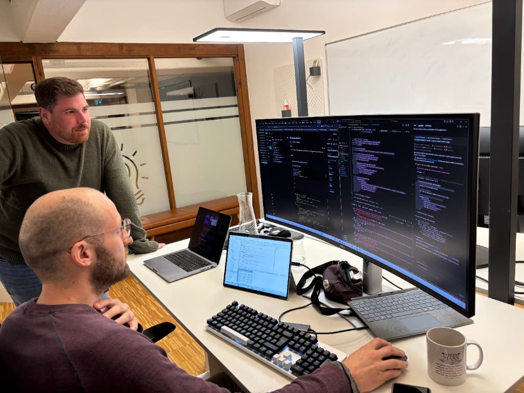 Roberto and Billy pair-programming on the Nandu agent architecture